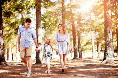 Buy stock photo Parents, kid hiking and holding hands in forest for holiday, family vacation and laugh together. Mother, father and funny child in woods for walking, support and trekking with happy girl on journey