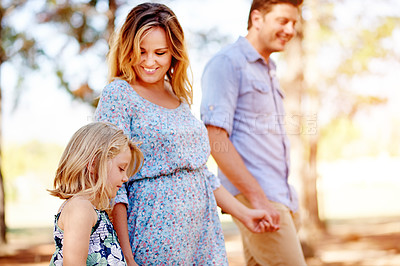 Buy stock photo Parents, child walking and holding hands for holiday, family vacation and bonding together in park. Mother, father and happy kid in nature for connection, support and travel with girl on journey