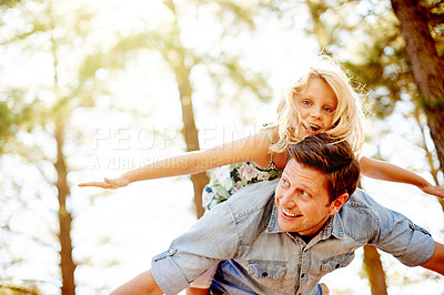 Buy stock photo Freedom, father and child with piggyback at park for flying together, creative imagination and trust. Low angle, dad and carry girl on back in nature for airplane game, portrait or support with space
