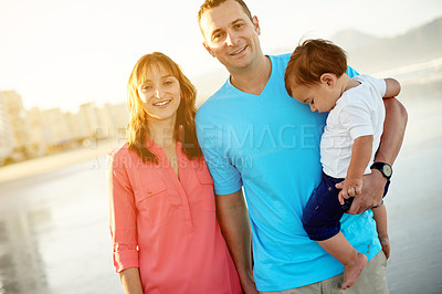 Buy stock photo Portrait, ocean and family with smile, boy and bonding together with summer holiday. Beach, parents and mother with father, child or happiness with vacation, travel or nature with tourism or break