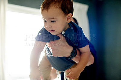 Buy stock photo Carry, fly or playing with father and son in living room of home together for bonding or fun. Fantasy, imagine or plane with boy child and single parent man in apartment for development or growth