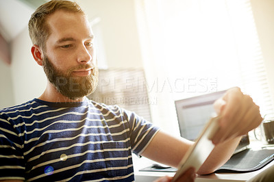 Buy stock photo Developer, research or man on tablet in startup office for software system or online update. Internet, web designer or backend engineer reading with technology for IT, review or homepage development