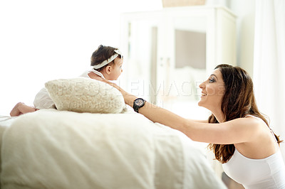 Buy stock photo Mom, baby and care in bedroom with love, protection and security in childhood for bonding. Happy woman, connection and wellness in family home with smile, safety and support in growth or development 