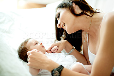 Buy stock photo Bed, cuddle or security with baby and mother in home together for bonding, growth or love. Development, relax and smile of woman parent with infant child in bedroom of apartment for connection