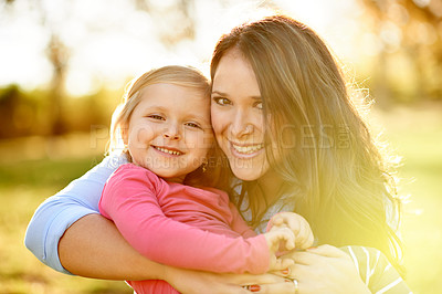 Buy stock photo Portrait, happy mother or child in nature with hug, support or bonding for childhood development. Smile, parent or daughter outdoor together on weekend break with flare, embrace or family connection