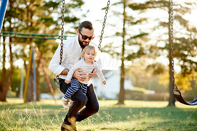 Buy stock photo Nature, swings and father with child in park for holiday, weekend or vacation together. Smile, trees and girl kid with dad for playing outdoor on playground for connection in summer at backyard.