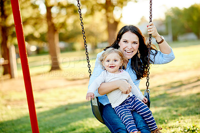 Buy stock photo Playground, happy and mom with child on swing for fun, adventure and playing together on weekend morning. Family, nature and mother with girl at park for bonding, relationship and connection outdoor