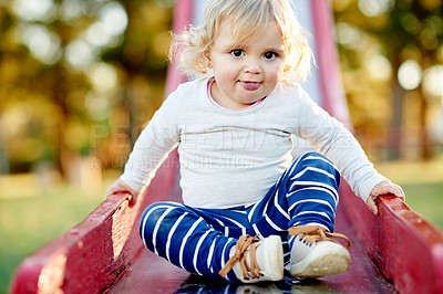 Buy stock photo Portrait, girl and kid in park, slide and happiness with fun, bokeh and vacation. Outdoor, development and child at playground, growth and toddler with childhood, relax and game with holiday