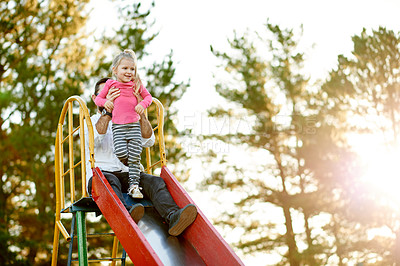 Buy stock photo Park, happy and dad with child on slide for outdoor adventure, playing and having fun together. Family, summer and father with girl on playground for bonding, connection and relationship in nature