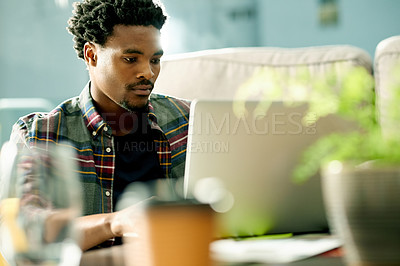 Buy stock photo Laptop, freelancer and black man in home for remote work with research and creative project in living room. Email, computer and African male copywriter with online article for publishing in apartment