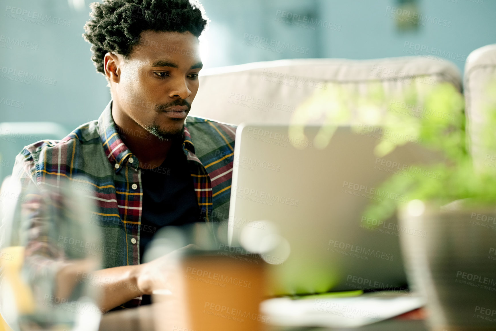 Buy stock photo Laptop, freelancer and black man in home for remote work with research and creative project in living room. Email, computer and African male copywriter with online article for publishing in apartment