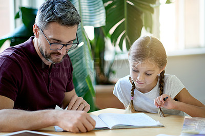 Buy stock photo Father, child and book for learning at house for study notes, homework and helping with education. Mature man, kid and reading for literature revision, homeschool activity and bonding in living room