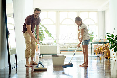 Buy stock photo Dad, happy child and mop floor for cleaning, learning hygiene or house maintenance with shine. Father, girl and chores in home with parent for help, teaching housekeeping or teamwork with family