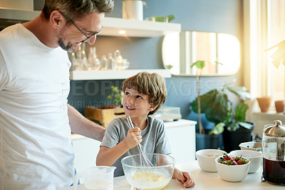 Buy stock photo Happy man, child and cooking at kitchen help with ingredients, mixing egg and preparation for baking. Mature father, son and smile in home with whisk, bonding and connection for homemade snack.