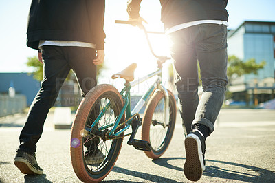 Buy stock photo Bicycle, legs and people for outdoor hobby, activity or challenge in urban park. Bike, shoes and feet for cycling, BMX training and skills for competition in city for walking and stunt exercise