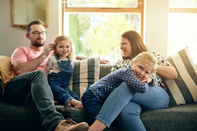 Buy stock photo Parents, children and relax on sofa, happy and bonding with care, love and portrait in living room. People, father and mother with kids, connection or smile on couch in lounge at family house