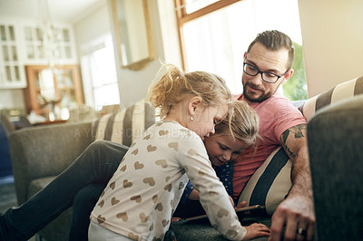 Buy stock photo Tablet, relax and father with girl children on sofa in living room of home for development. App, browsing or elearning with single parent man and daughter kids in apartment together for growth