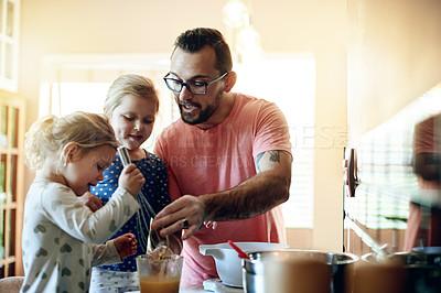 Buy stock photo Baking, home and father with girls, talking and bonding together with ingredients. Family, parent and dad in kitchen, daughters or help with recipe, cooking and development with children and mixing