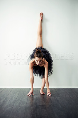 Buy stock photo Balance, art and woman in studio for ballet motion, creative ballerina and training. Wall, white background or flexible dancer in routine with elegance, space or talent for exercise, body or dancing