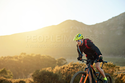 Buy stock photo Man, mountain or sunset with bike for cycling, extreme sport or fitness on dirt track in nature. Active, male person or cyclist riding with helmet on off road or desert terrain in outdoor wilderness