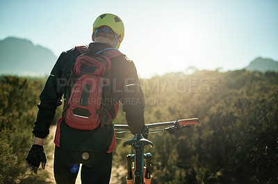 Buy stock photo Man, walking and bicycle in nature for fitness, journey or travel break on trail. Back, tired athlete or bike on mountain path for catching breath, explore track or trekking at sky space in Australia