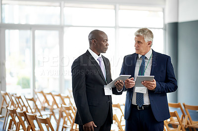 Buy stock photo Businessman, tablet and talk for networking at conference with app, introduction and schedule for meeting. People, exchange contact and tech for planning, calendar or chat at international convention