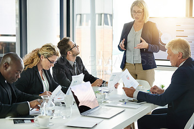 Buy stock photo Boardroom, presentation and woman with team, talking and financial strategy with paperwork for info. Reading, document and accountant with project update, graph or  meeting for investment opportunity
