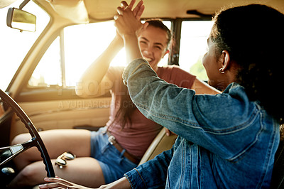 Buy stock photo High five, road trip and women in car for holiday, travel or vacation on outdoor adventure. Flare, explore or friends with celebration, bonding and vehicle for weekend getaway, scenery or journey
