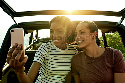 Buy stock photo Road trip, friends and selfie of women by car for memory on vacation, adventure and journey in nature. Travel, holiday and happy people with photo, profile picture and flare for social media post