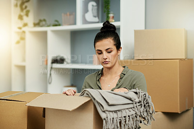 Buy stock photo Serious, woman and packing with box for move, home donation or thinking of charity in house. Female person, package or cargo with sorting of private property for sale or relocation in apartment