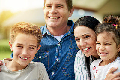 Buy stock photo Outdoor, new home and family with smile, children and embrace with break, real estate and relax. Parents, kids and mother with father, happiness or fun with lens flare, property or bonding together