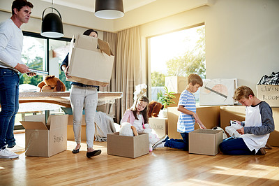 Buy stock photo Unpacking, family and parents with children, boxes and milestone with new home, moving and real estate. Property, ownership and people with kids in living room, love and investment with mortgage