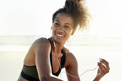 Buy stock photo Happy, athlete and woman with earphones, beach and music for training routine, thinking and fitness. Outdoor, runner and black person with tech for audio, rest and workout with playlist in nature