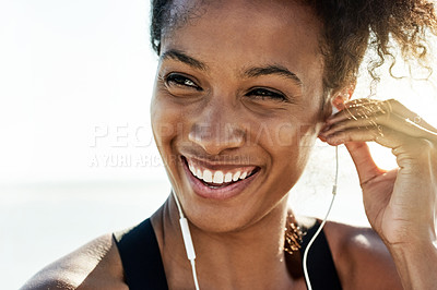 Buy stock photo Earphones, exercise and thinking with woman on beach for start of cardio training or workout in summer. Fitness, flare and planning with African athlete or runner streaming music outdoor for health