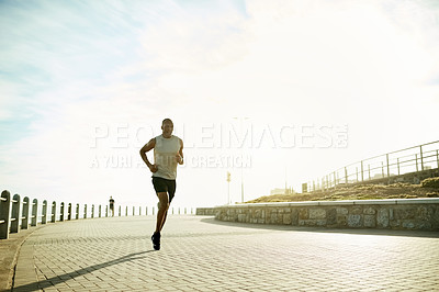 Buy stock photo Black man, fitness and running with sky on promenade for workout, exercise or cardio training. Active, male person or runner with flare or space for outdoor marathon challenge, health and wellness