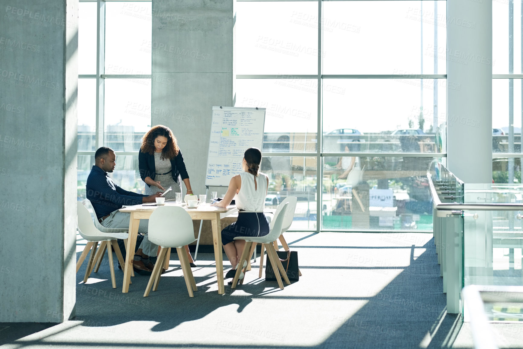 Buy stock photo Meeting, business people and discussion with notebook for presentation, compliance proposal or help. Presenter, training or planning in office with team to review policy, strategy or explain feedback