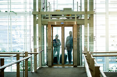 Buy stock photo Elevator, travel and luggage with business people in hotel for conference, booking accommodation and seminar. Convention arrival, suitcase and reservation with employees for hospitality and trip