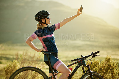 Buy stock photo Selfie, cycling and woman with practice, bike and content creation with training. Outdoor, cyclist and person with profile picture, mountains or bicycle with fitness, memory or travel with influencer