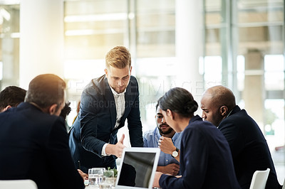 Buy stock photo Boardroom, pitch and man in meeting, talking and planning for proposal, discussion or brainstorming. Corporate, business analyst and people with tech for opportunity, conversation and ideas in office