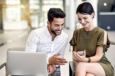 Buy stock photo Phone, colleagues and business people in airport for waiting, summit event or convention. Flight schedule, laptop and man with happy woman in lobby for meme, international conference or travel time