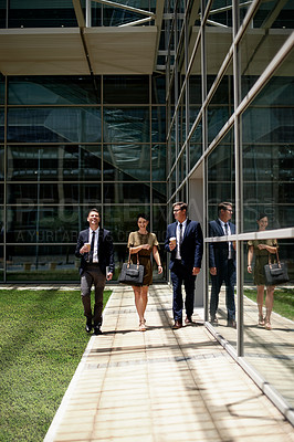 Buy stock photo Outdoor, business and people with smile by glass office, conversation and commute for work day. Happy, colleagues or travel to workplace with discussion, friendship and commitment in corporate career