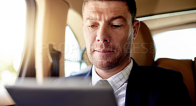 Buy stock photo Tablet, reading and business man in car for chauffeur service, contact and vip passenger. Concierge fleet, event schedule or security transport with mature person for conference arrival time
