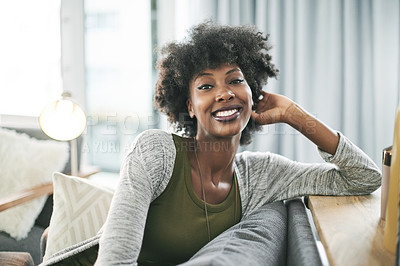 Buy stock photo Portrait, happiness and black woman in lounge, calm and comfortable on weekend, peace and apartment. Relax, person and rest on couch, smile or confident in home, break or positive attitude in Nigeria