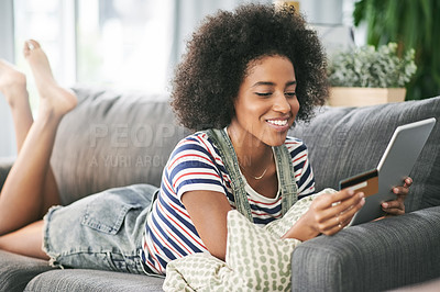 Buy stock photo Happy, black woman and credit card with tablet on sofa for online shopping or payment in home. Female person, shopper or user with smile, debit or technology for ecommerce or remote banking in house