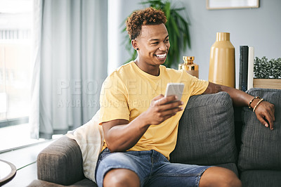Buy stock photo Thinking, cellphone and man on sofa in home with networking, communication or social media on mobile app. Happy, ideas and male person with phone for texting, contact or chatting in living room.