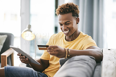 Buy stock photo Black man, tablet and happy on sofa with credit card, sale and budget for ecommerce on web in home. Person, smile and fintech app for discount, online shopping or easy payment with banking at house