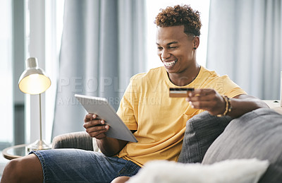 Buy stock photo Black man, tablet and happy on couch with credit card, sale or budget for online shopping in home. Person, excited and fintech app for discount, ecommerce and easy payment for banking on web at house
