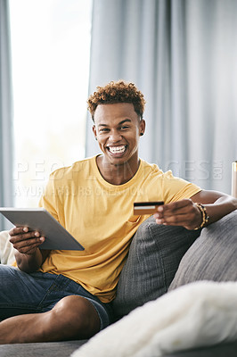 Buy stock photo Credit card, tablet and portrait of happy man on sofa in living room of home for checkout payment. App, ecommerce and smile of customer person in apartment for internet purchase or online shopping