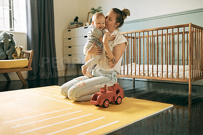 Buy stock photo Mother love, baby and kiss in home, bonding and having fun together in house. Development, happiness and mama kissing child, kid or newborn, affection and care while enjoying quality time in nursery.