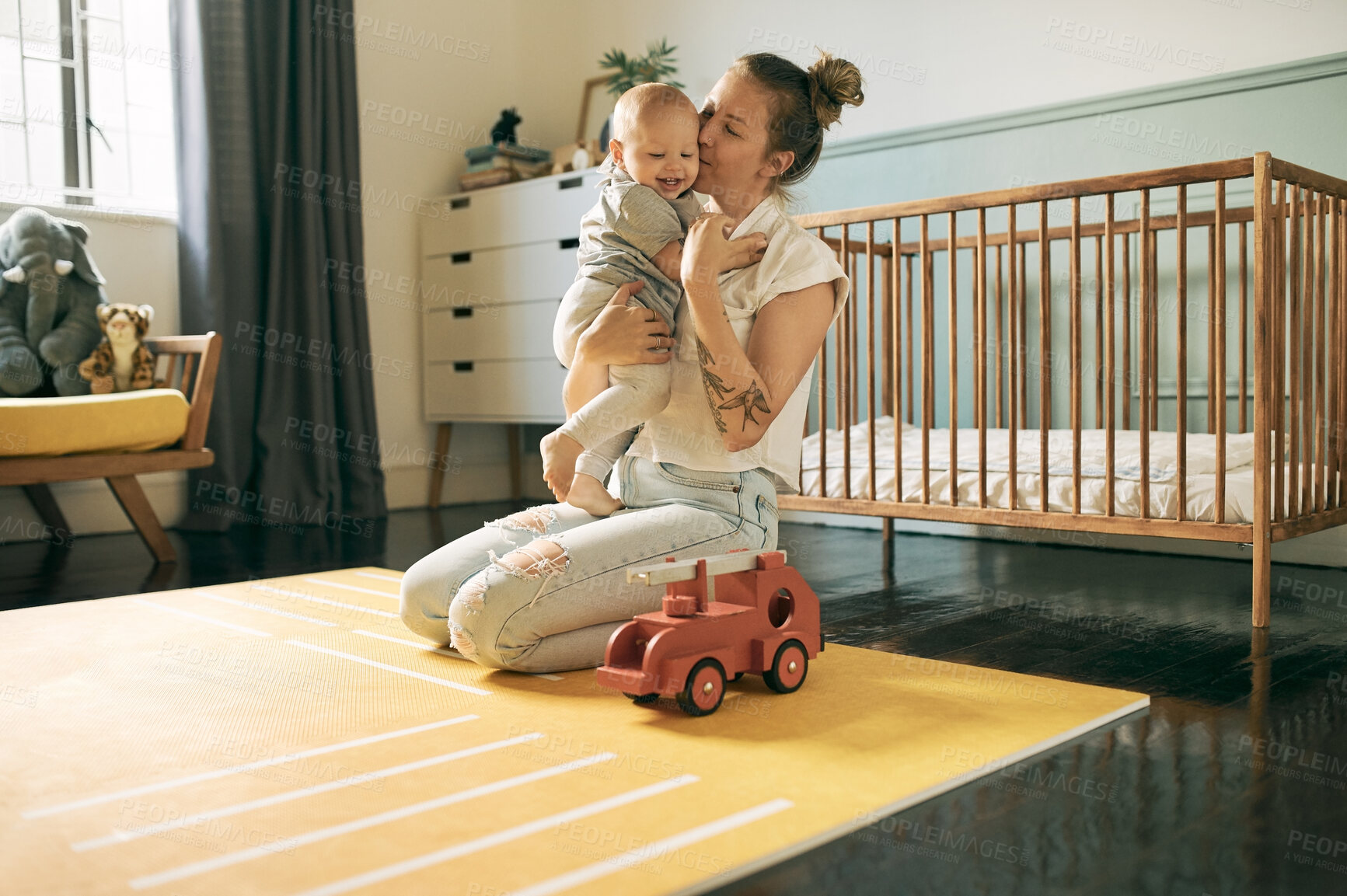 Buy stock photo Mother love, baby and kiss in home, bonding and having fun together in house. Development, happiness and mama kissing child, kid or newborn, affection and care while enjoying quality time in nursery.